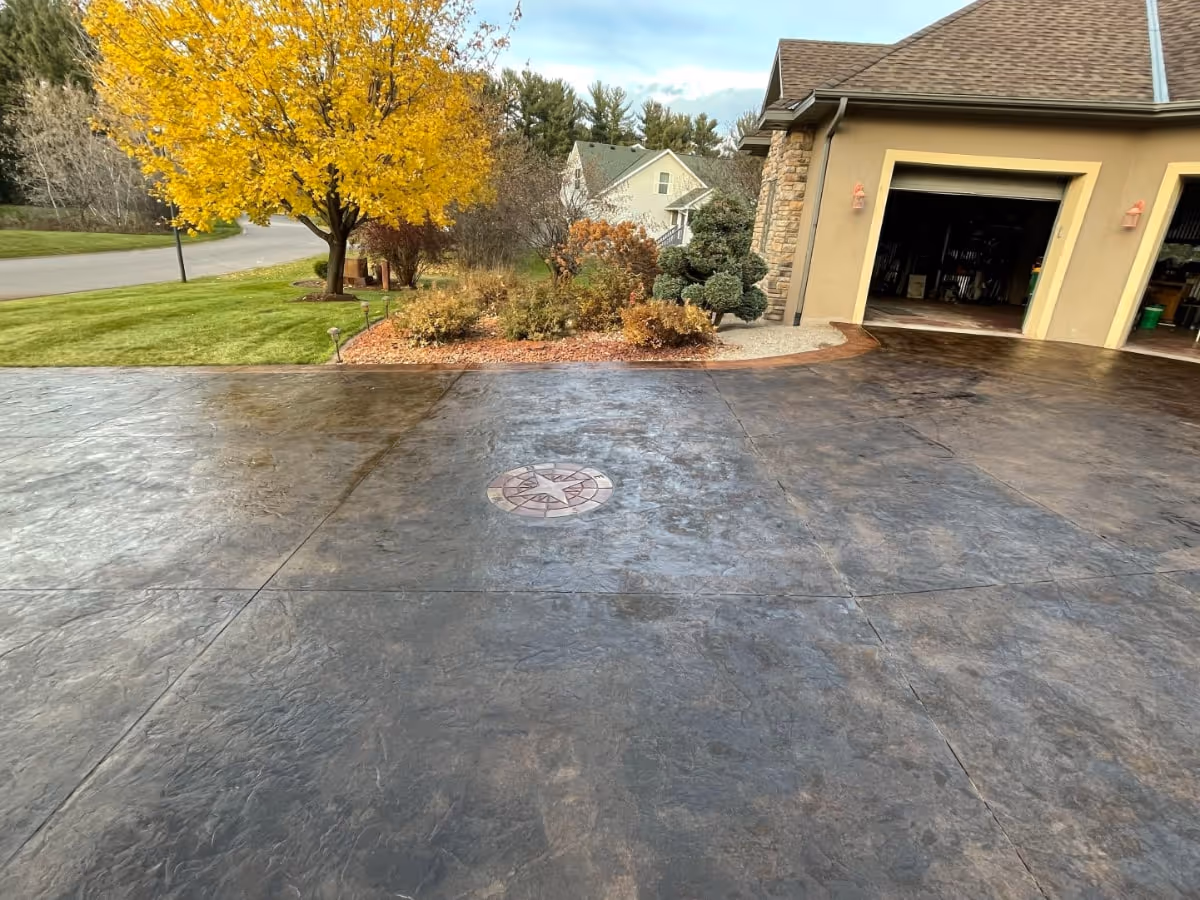 new stamped and stained concrete driveway