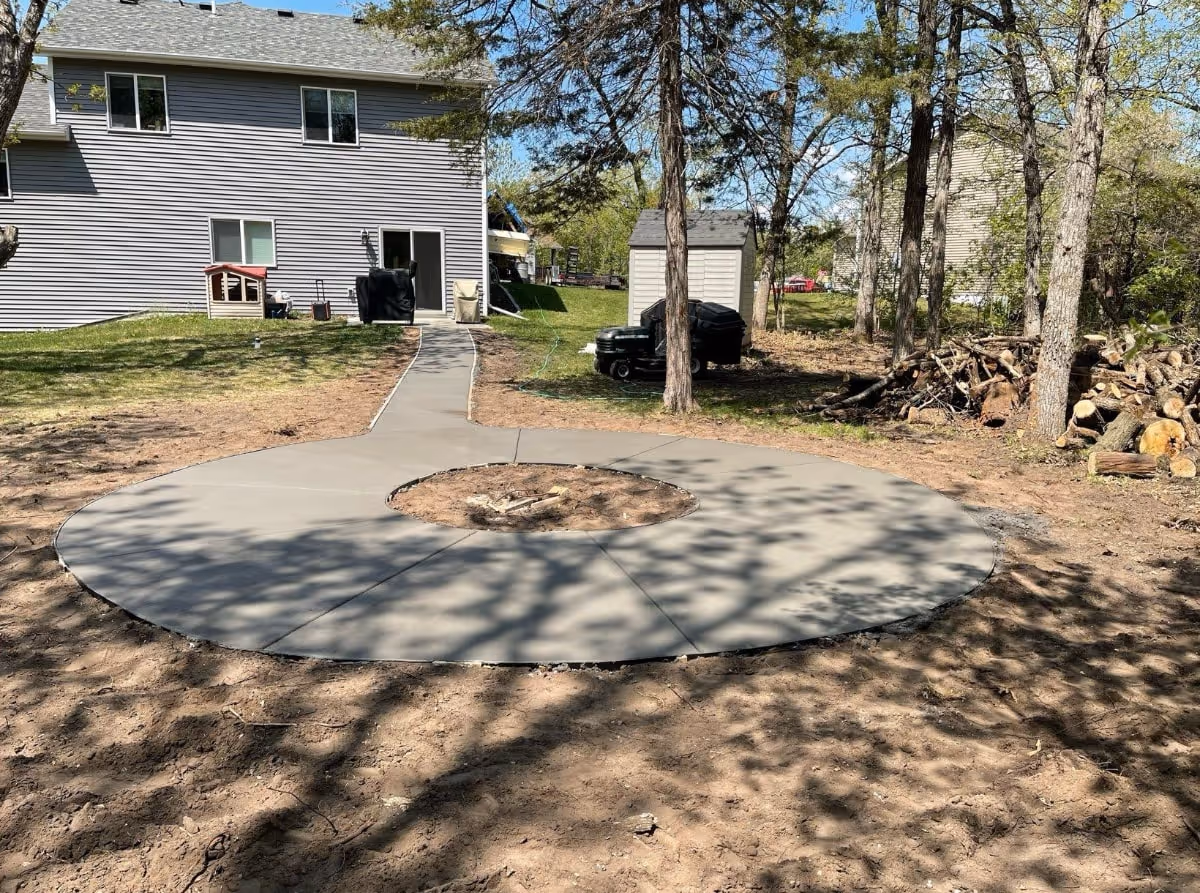 new fire ring with concrete patio 
