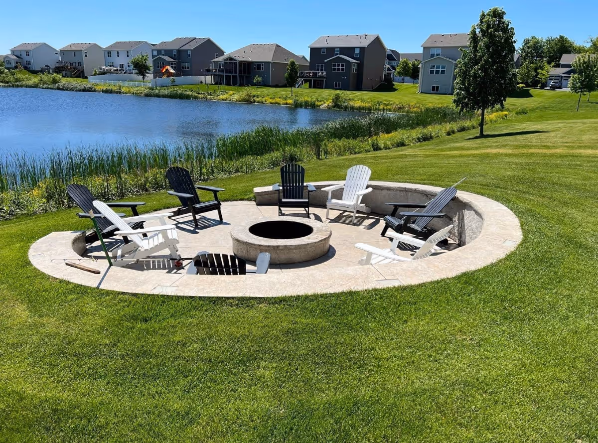 concrete circle patio around patio with chairs