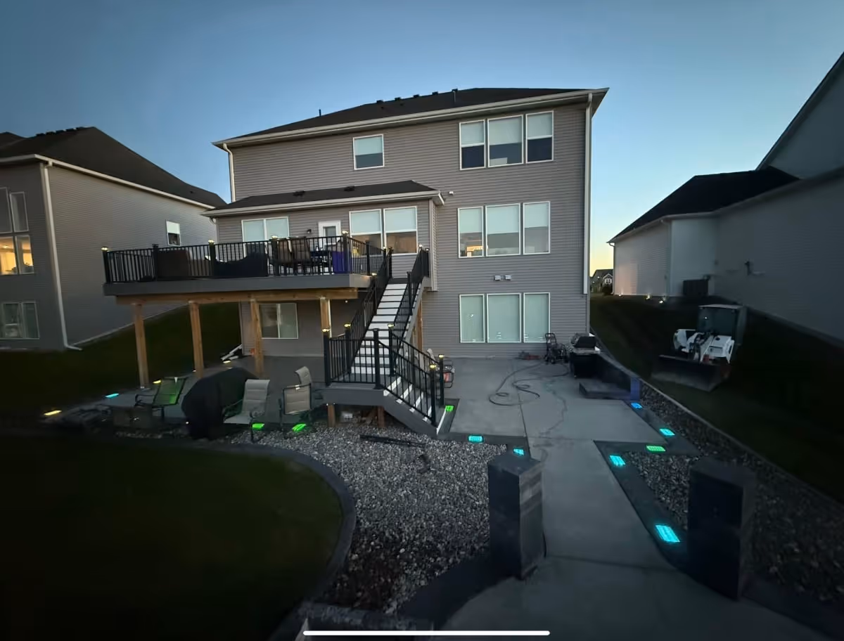 patio to firepit lit up with lights in concrete