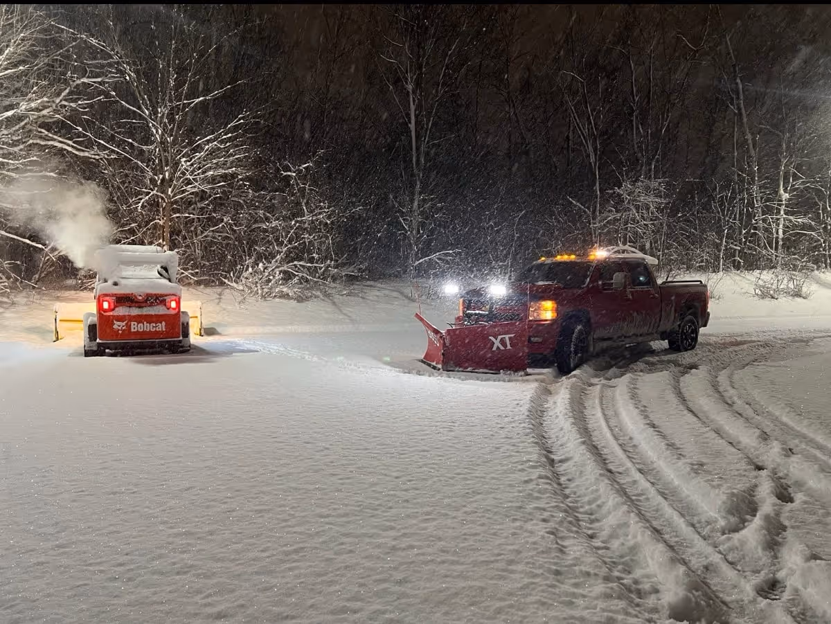 skid-steer loader and pickup truck snow removal