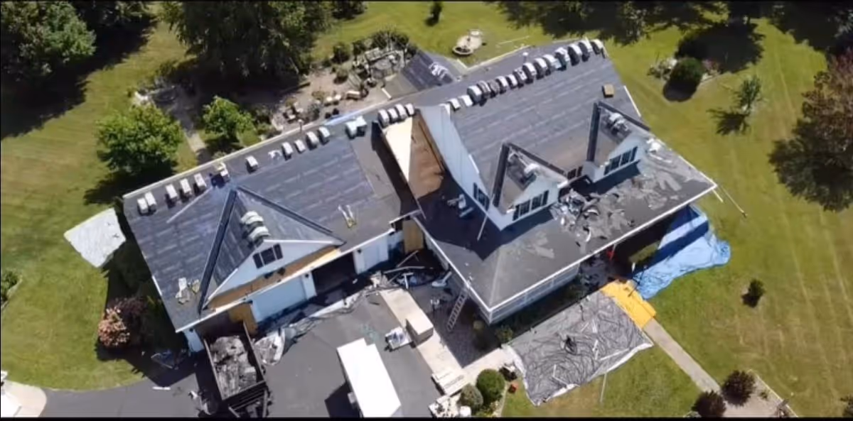 large roofing project with shingles bundled on top to be added to roof