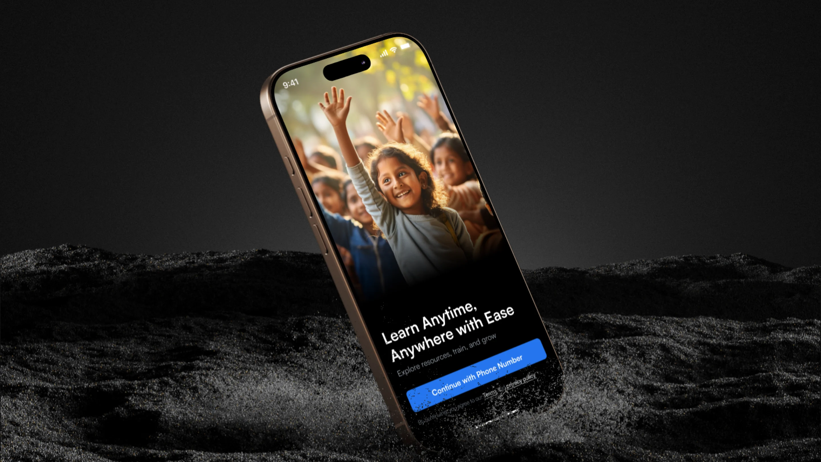 Smartphone displaying an educational app screen with children raising their hands, showing text 'Learn Anytime, Anywhere with Ease' and a blue button labeled 'Continue with Phone Number.'