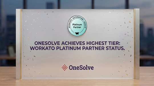 OneSolve team receiving the 2026 Workato Innovation Partner of the Year award on stage in Denver