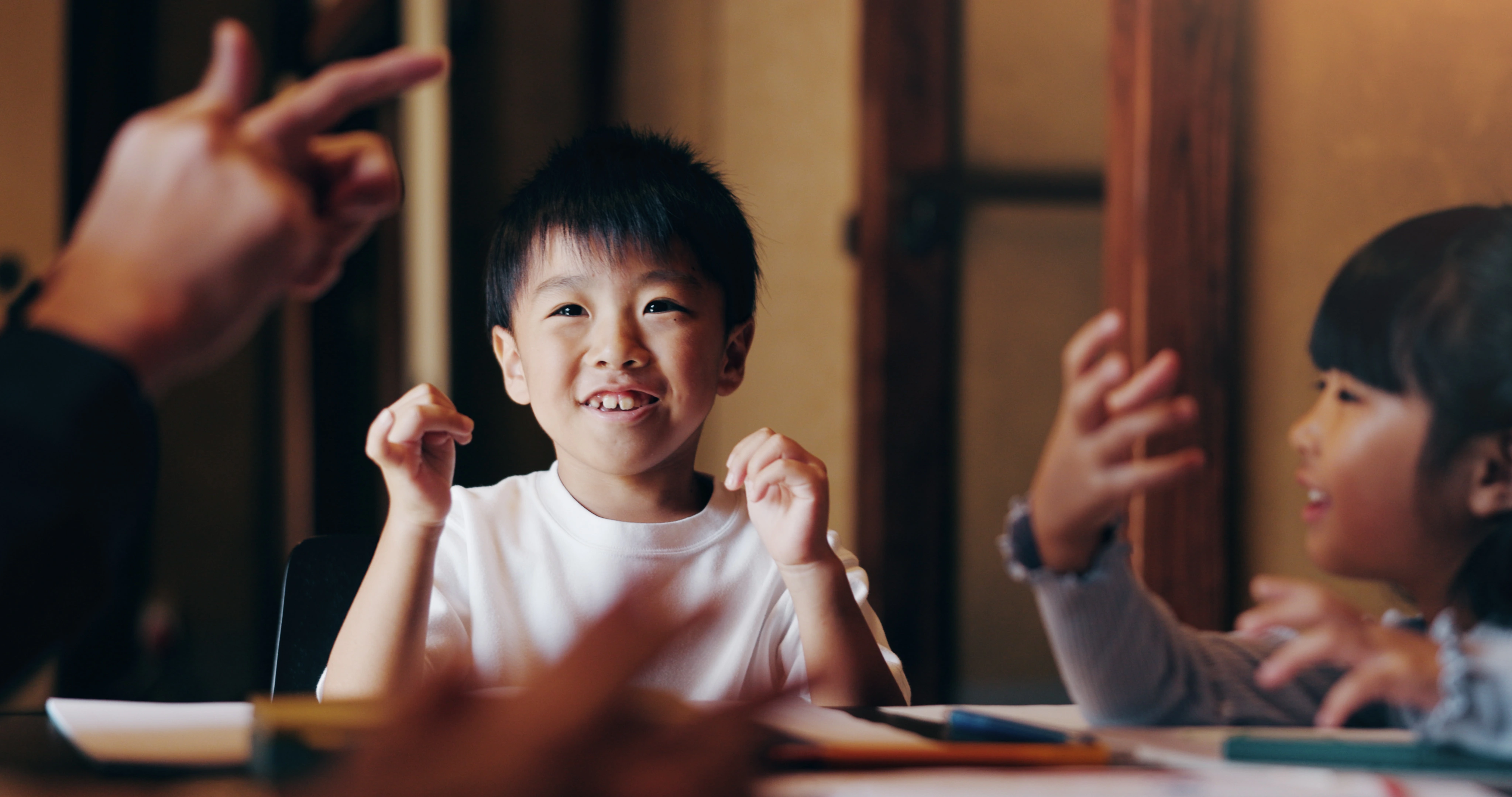 Child practicing expressive speaking during class activity