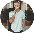 Portrait of smiling man in casual white t-shirt outdoors