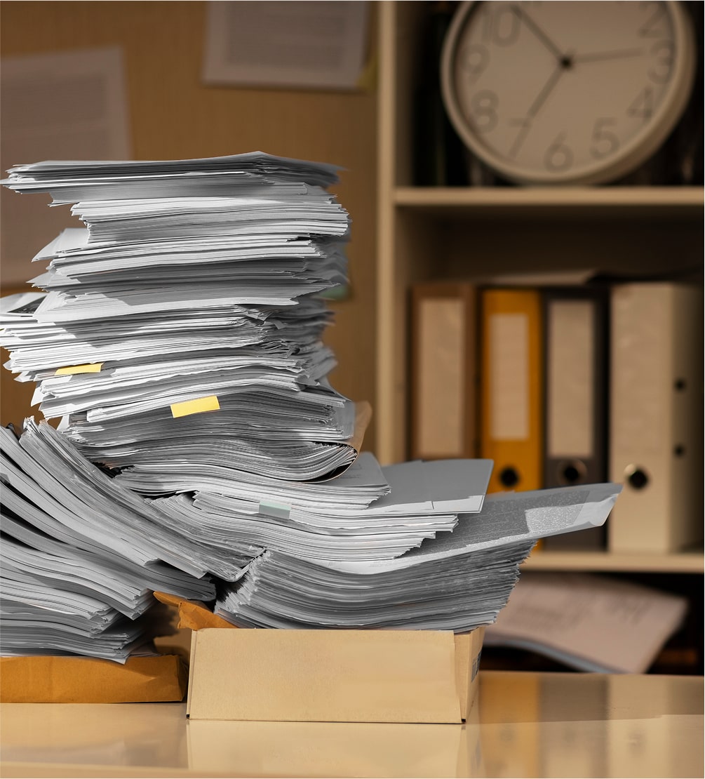 Large stack of paper documents ready for bulk scanning