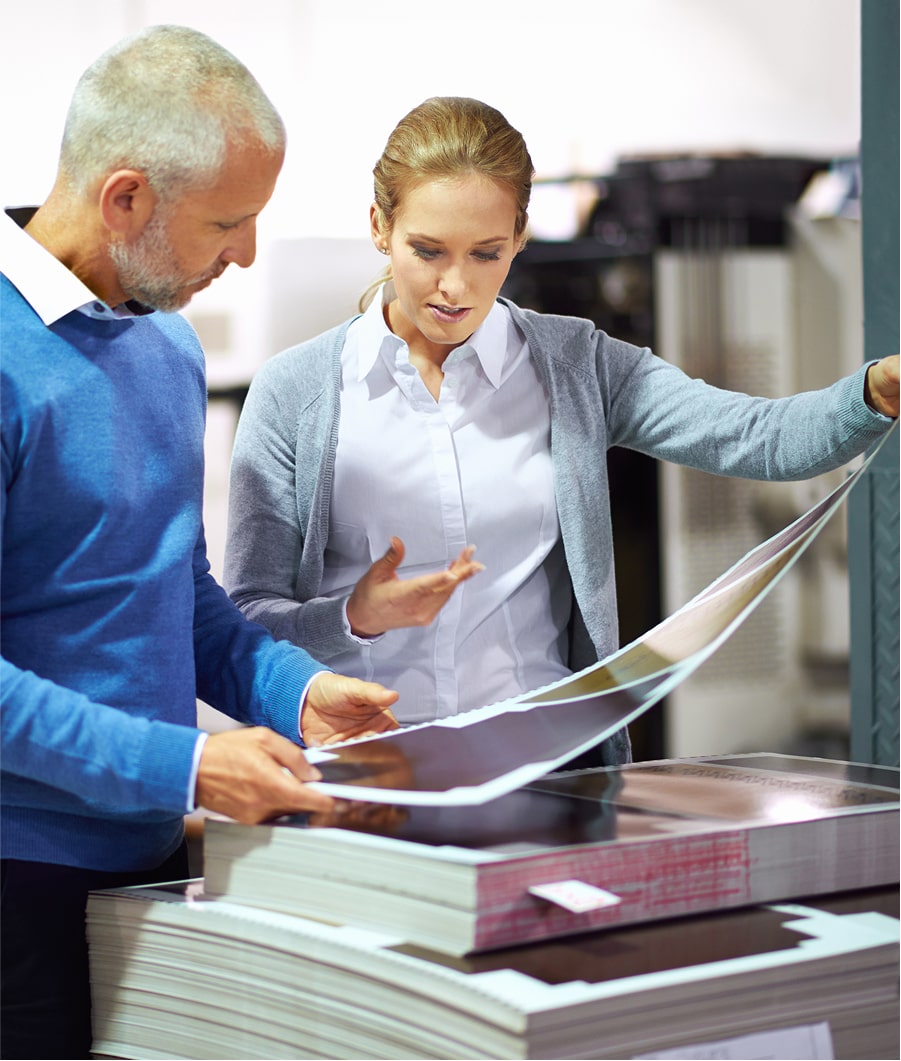 Team collaborating on large-format printed documents