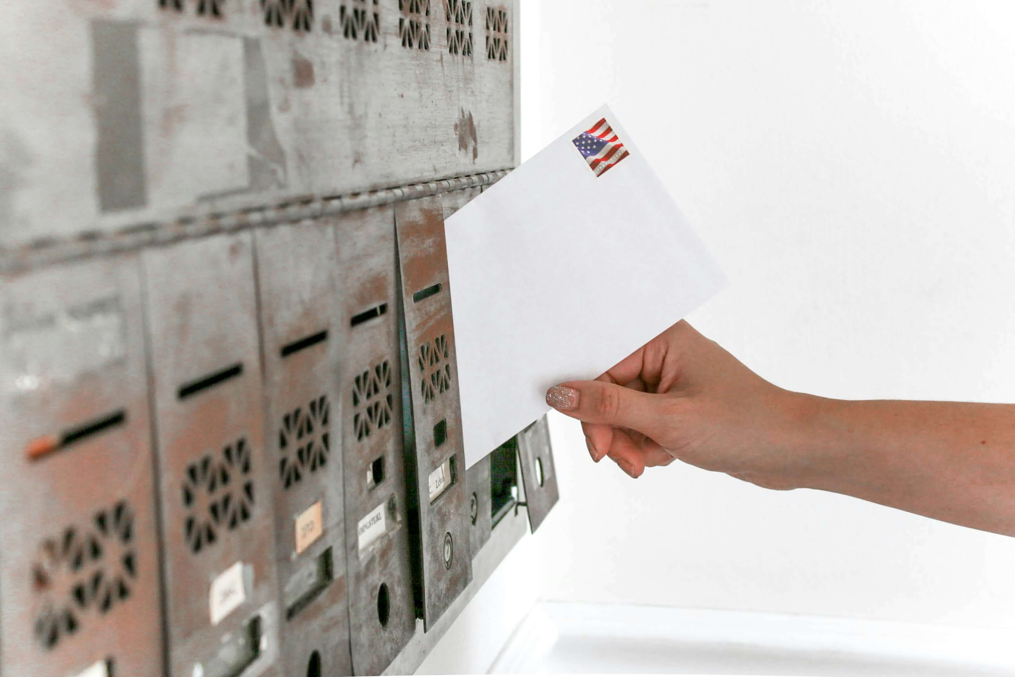 A technician prepping opened business mail for scanning in a Southern California digital mailroom