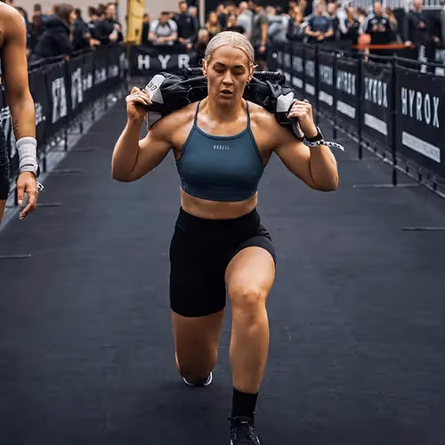 sandbag lunges in Hyrox