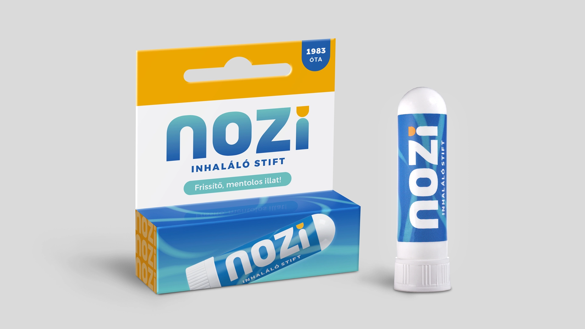 Nozi inhaláló stift és akasztós csomagolása szürke háttéren
