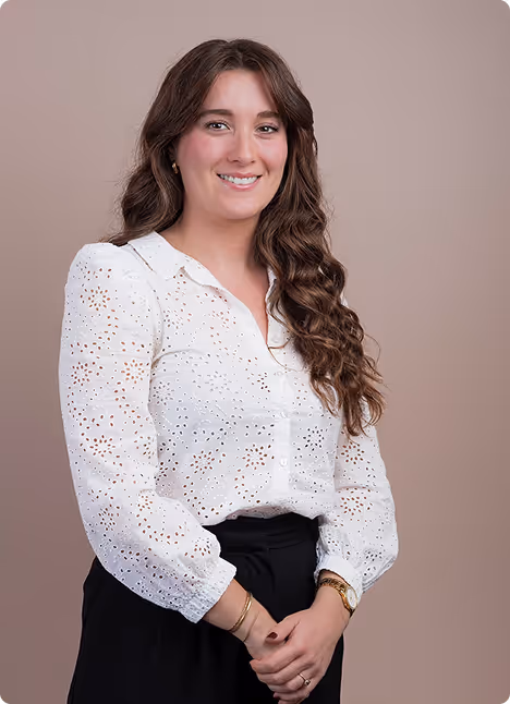 A woman with long hair and a black shirt.