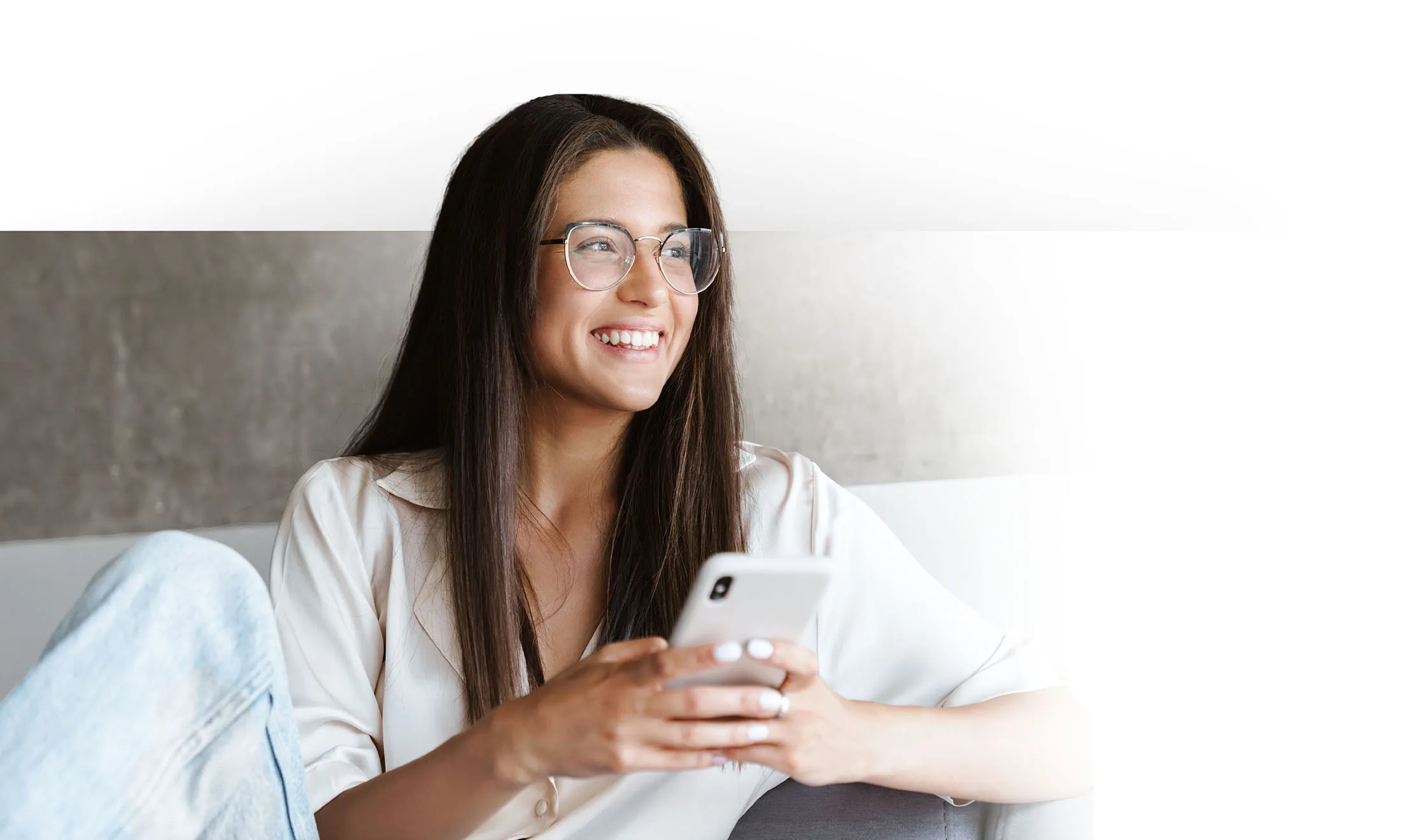 Women smiling while on phone