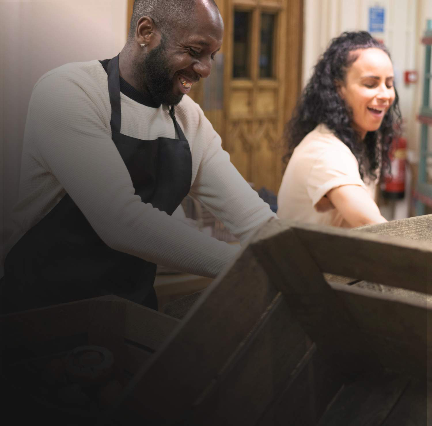 Man and women packing meals at a food pantry