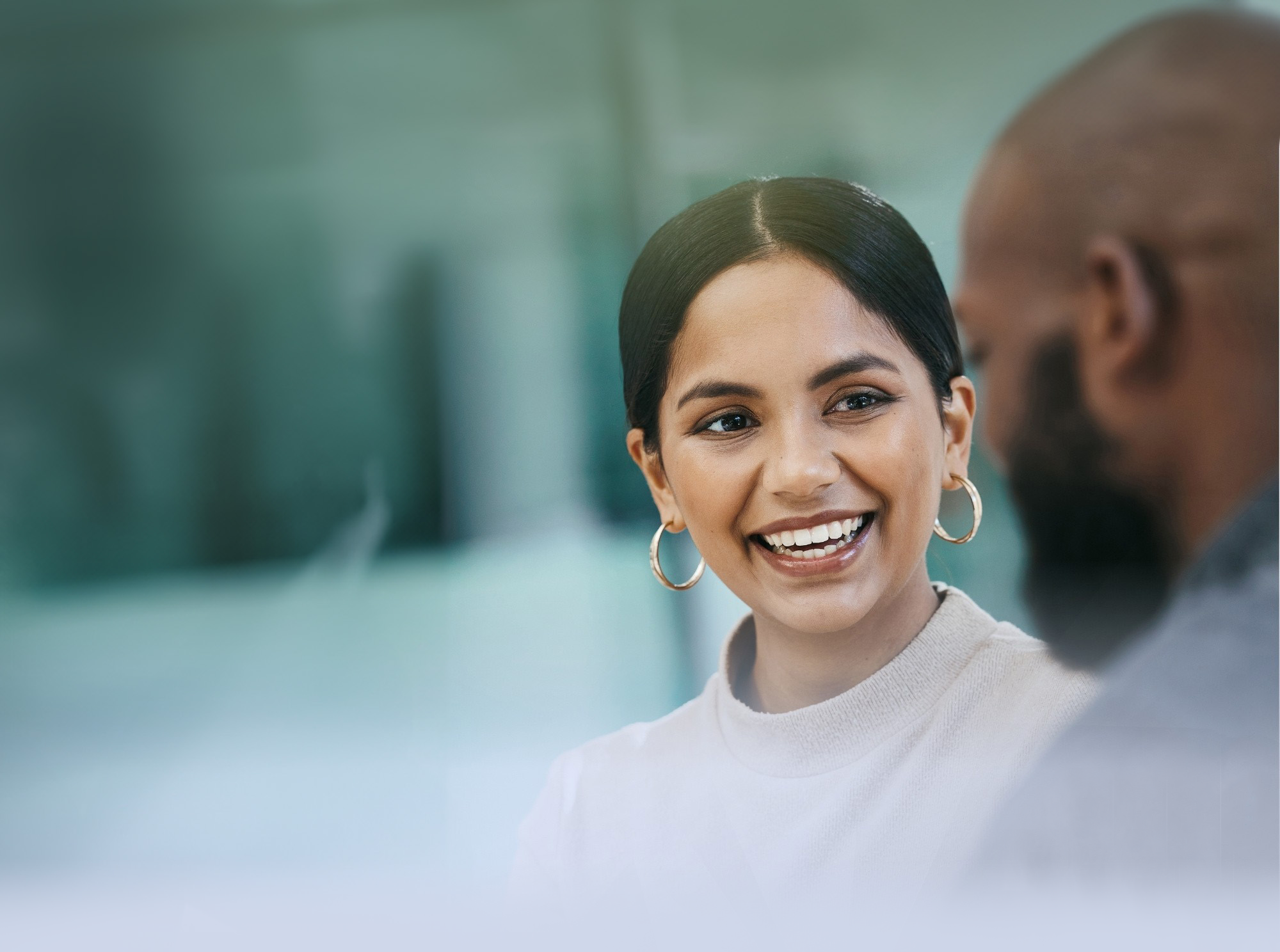 Woman smiling and talking with a man