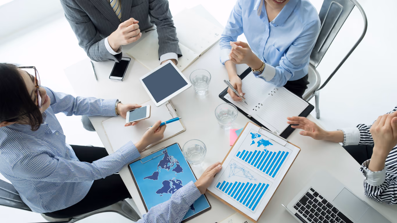 Business professionals reviewing documents in a meeting