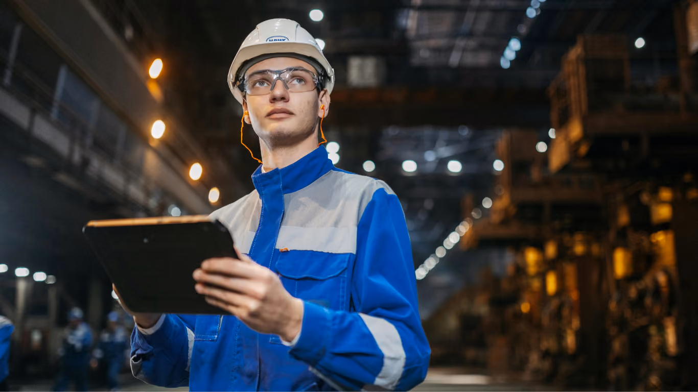 Engineer with tablet at industrial site