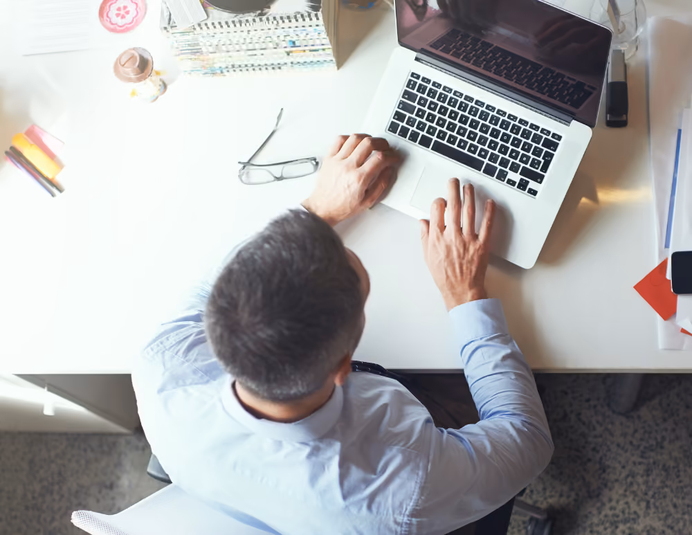 Person typing on laptop