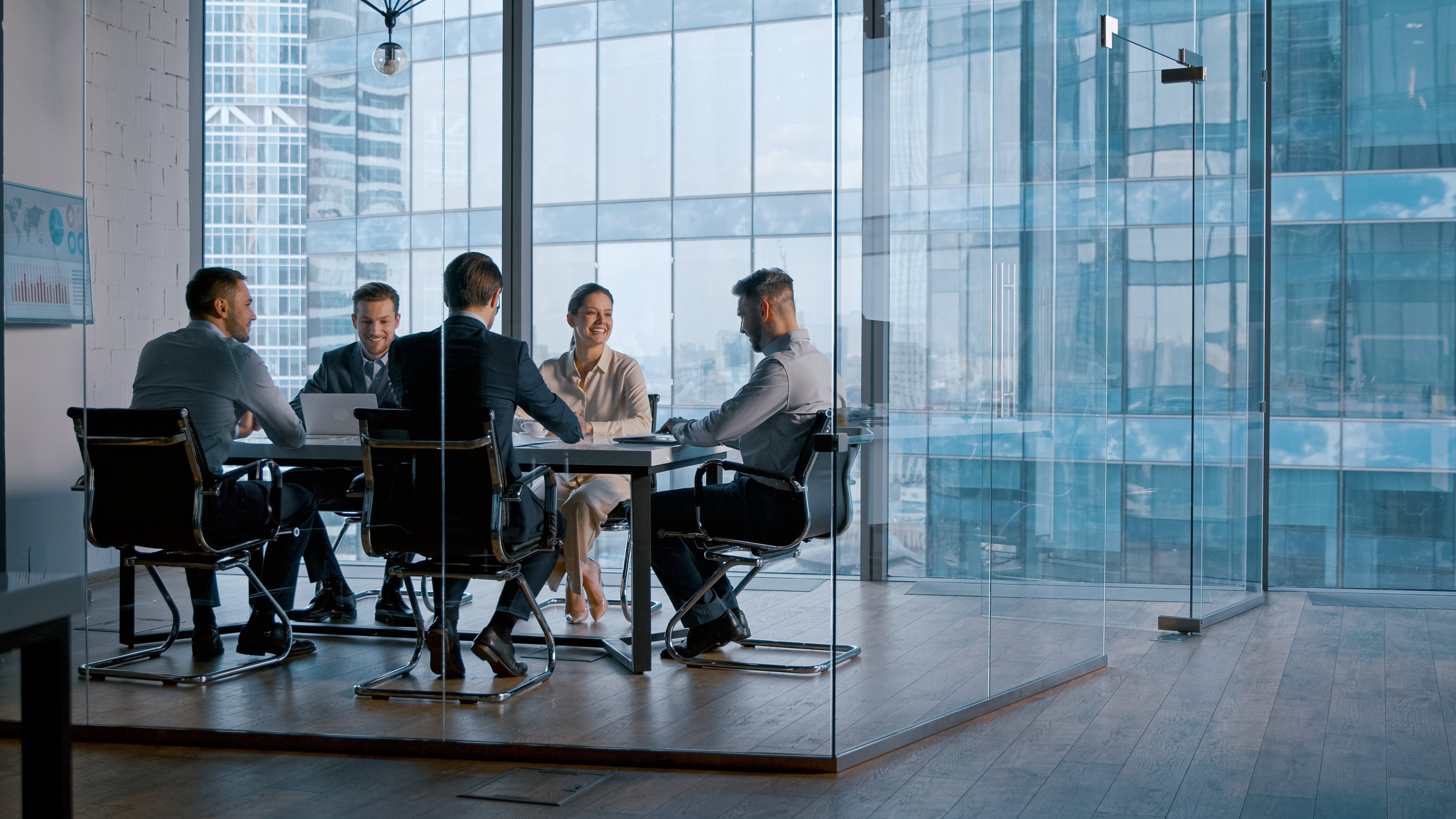 Team meeting in glass office