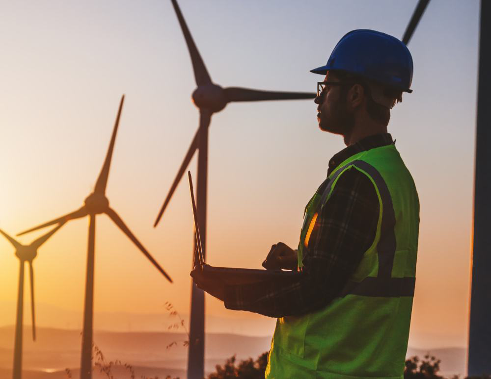 Energy professional working near wind turbines