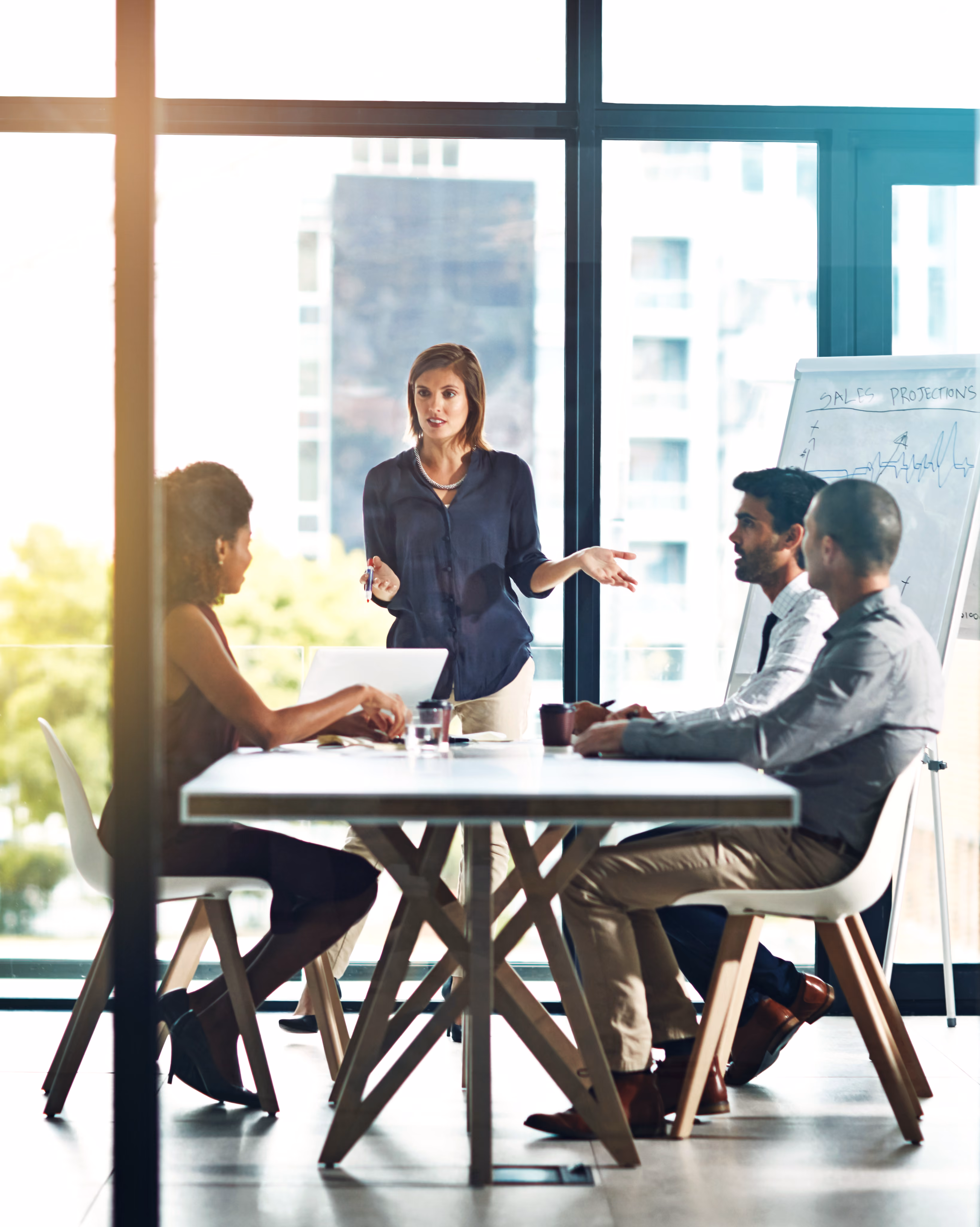 Team meeting in a glass conference room