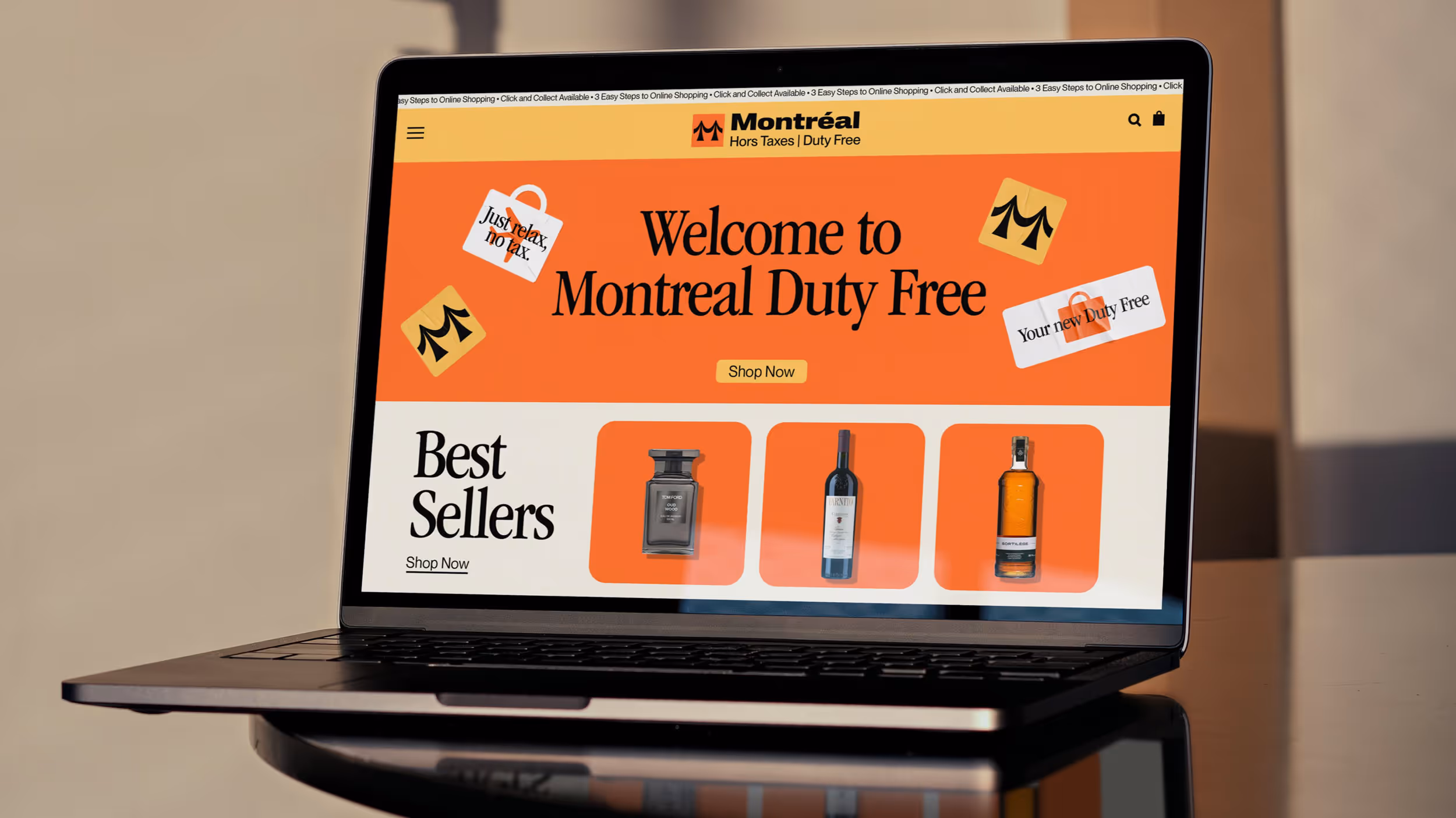 Laptop screen showing Montreal Duty Free website homepage with best sellers including perfume, wine, and whiskey bottles.