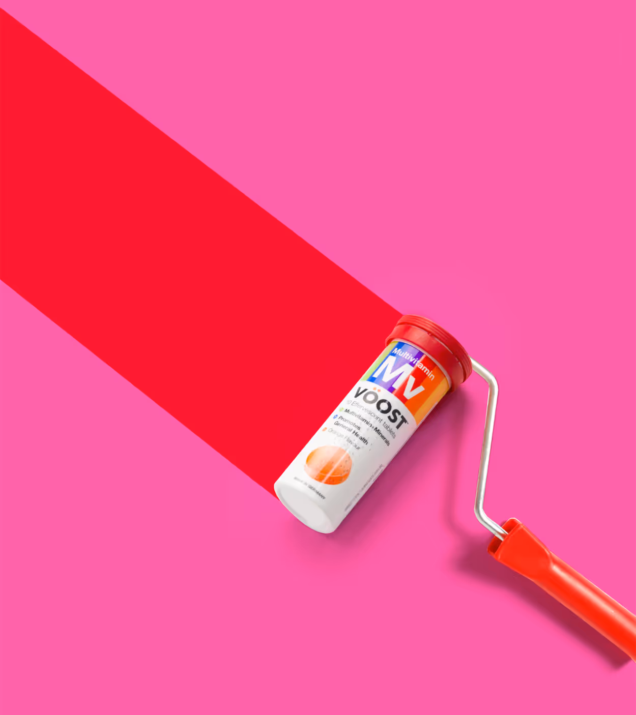 Paint roller with a red handle rolling a bright red stripe on a pink background, using a container of multivitamin effervescent tablets as the roller head.