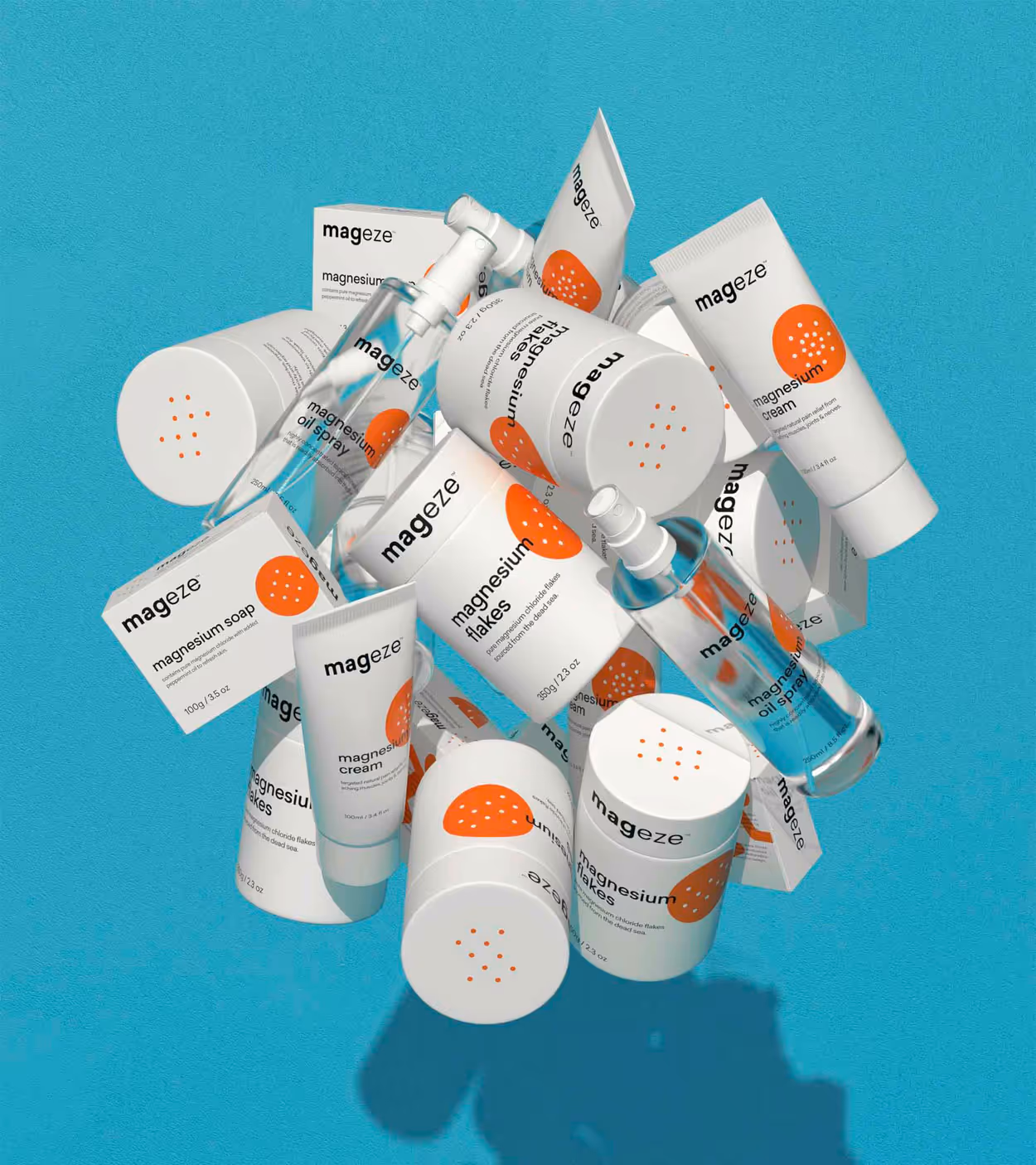 Assortment of Mageze magnesium products including flakes, cream, soap, and oil spray on a blue background.