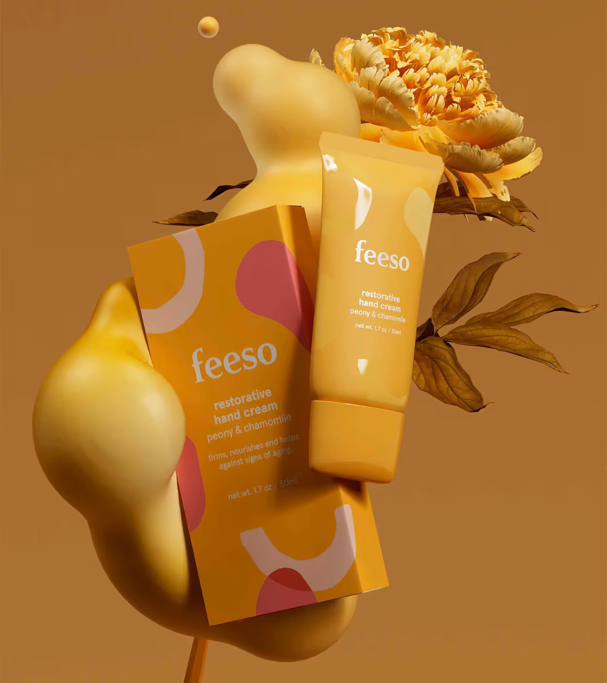 Yellow packaging and tube of Feeso restorative hand cream with peony and chamomile, displayed with a yellow peony flower and abstract yellow shapes.