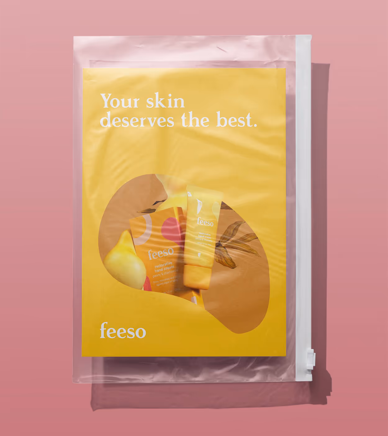 Transparent zip pouch with a yellow card displaying two Feeso restorative hand cream tubes and text 'Your skin deserves the best.'