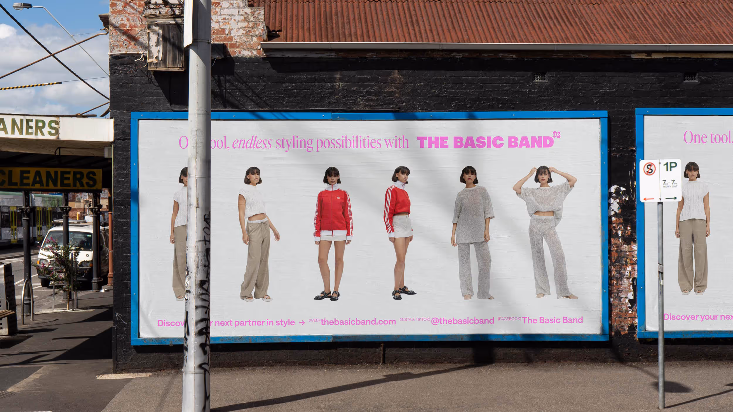 Street billboard showing six female models in casual and sportswear with text promoting The Basic Band styling possibilities.