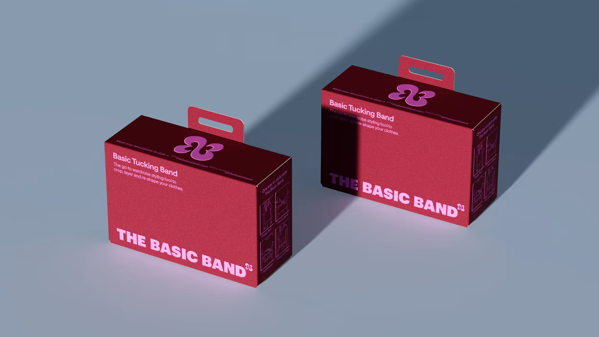 Two maroon boxes of Basic Tucking Band with pink text and logo on a light blue surface.