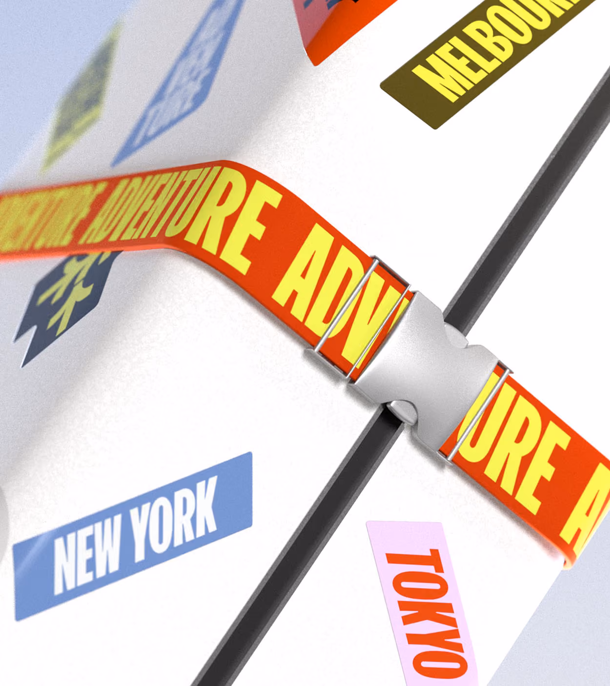 Close-up of a white suitcase with colorful city name stickers including New York, Tokyo, and Melbourne, secured by a red strap with yellow 'ADVENTURE' text.