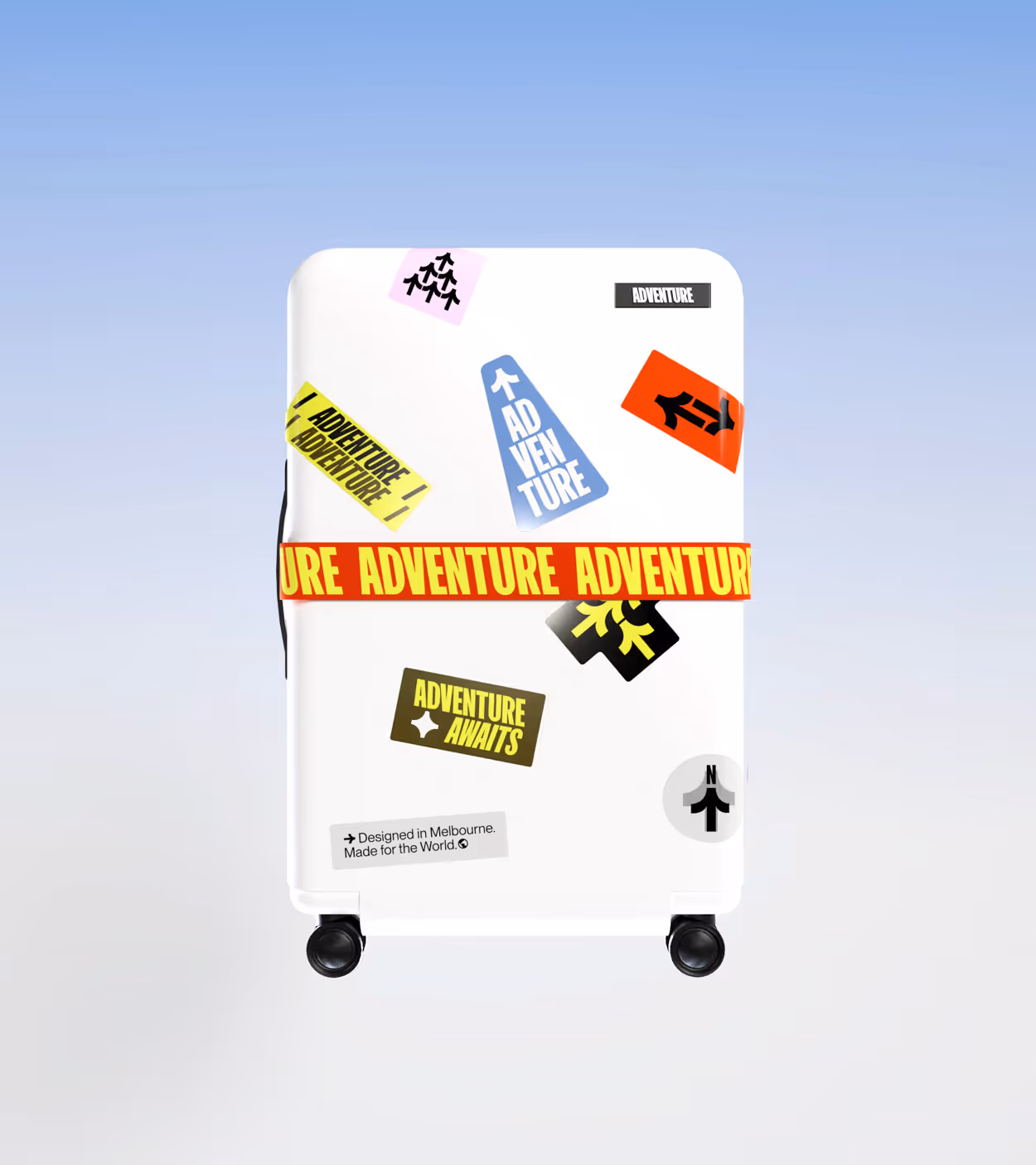 White suitcase with colorful adventure-themed stickers and a red strap with yellow text reading 'ADVENTURE'.