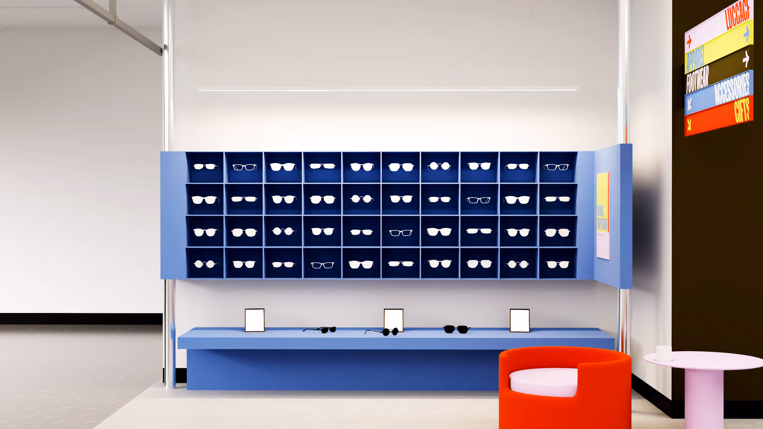 Modern eyeglasses display wall with multiple pairs of glasses in blue cubbies above a blue counter, next to a red chair and small round table.