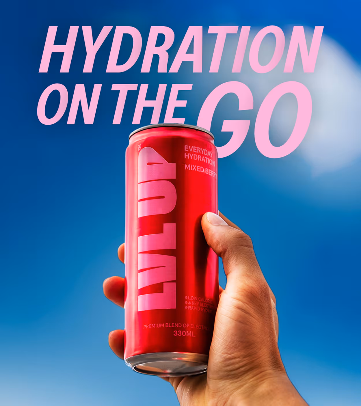Hand holding a red can of LVLYU hydration drink against a blue sky with pink text 'HYDRATION ON THE GO'.