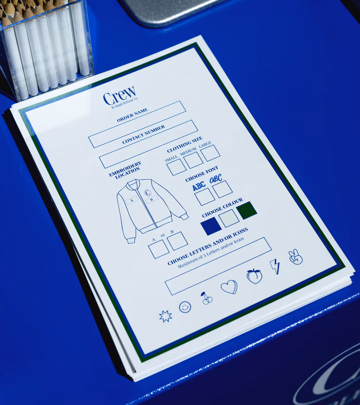 Order form for custom jackets with fields for order name, contact number, embroidery location options, clothing size choices, font styles, colors, and icons.