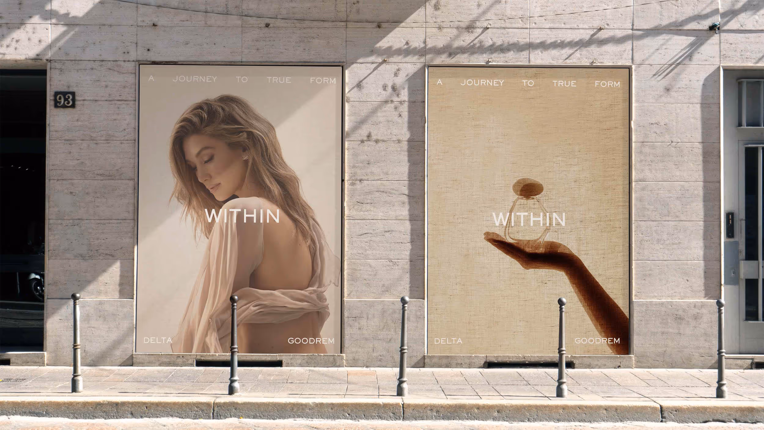 Two side-by-side posters on a stone building facade, each with the text 'A journey to true form' and 'Within'; the left shows a woman with long hair and a bare back draped in a light fabric, the right shows a hand holding a glass object.