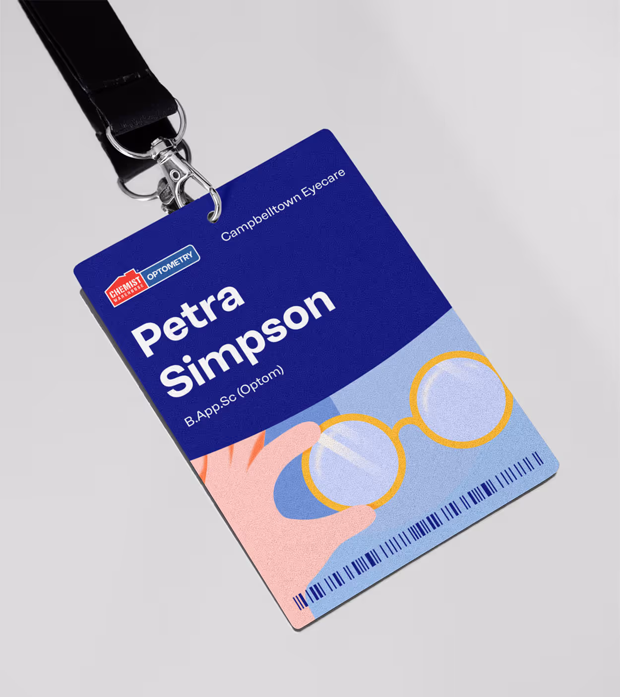 ID badge for Petra Simpson, B.App.Sc (Optom) at Campbelltown Eyecare with illustration of a hand holding round glasses and Chemist Warehouse Optometry logo.