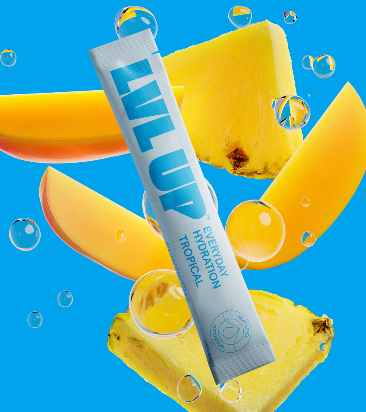 LVL UP Everyday Hydration Tropical sachet surrounded by pineapple and mango slices with water droplets.