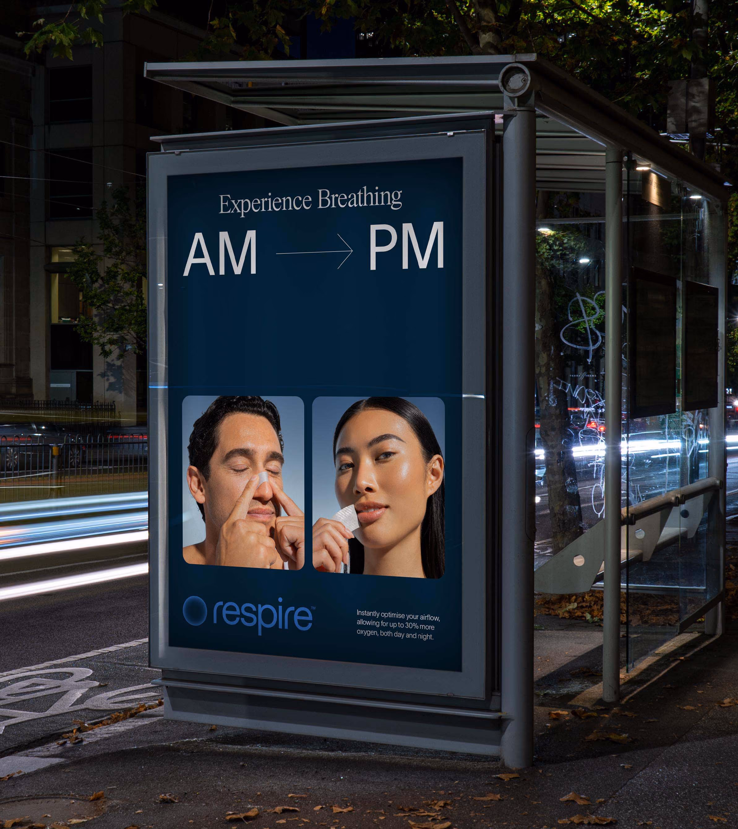 Bus stop ad showing a man using a nose clip and a woman holding a nasal strip for breathing aid.