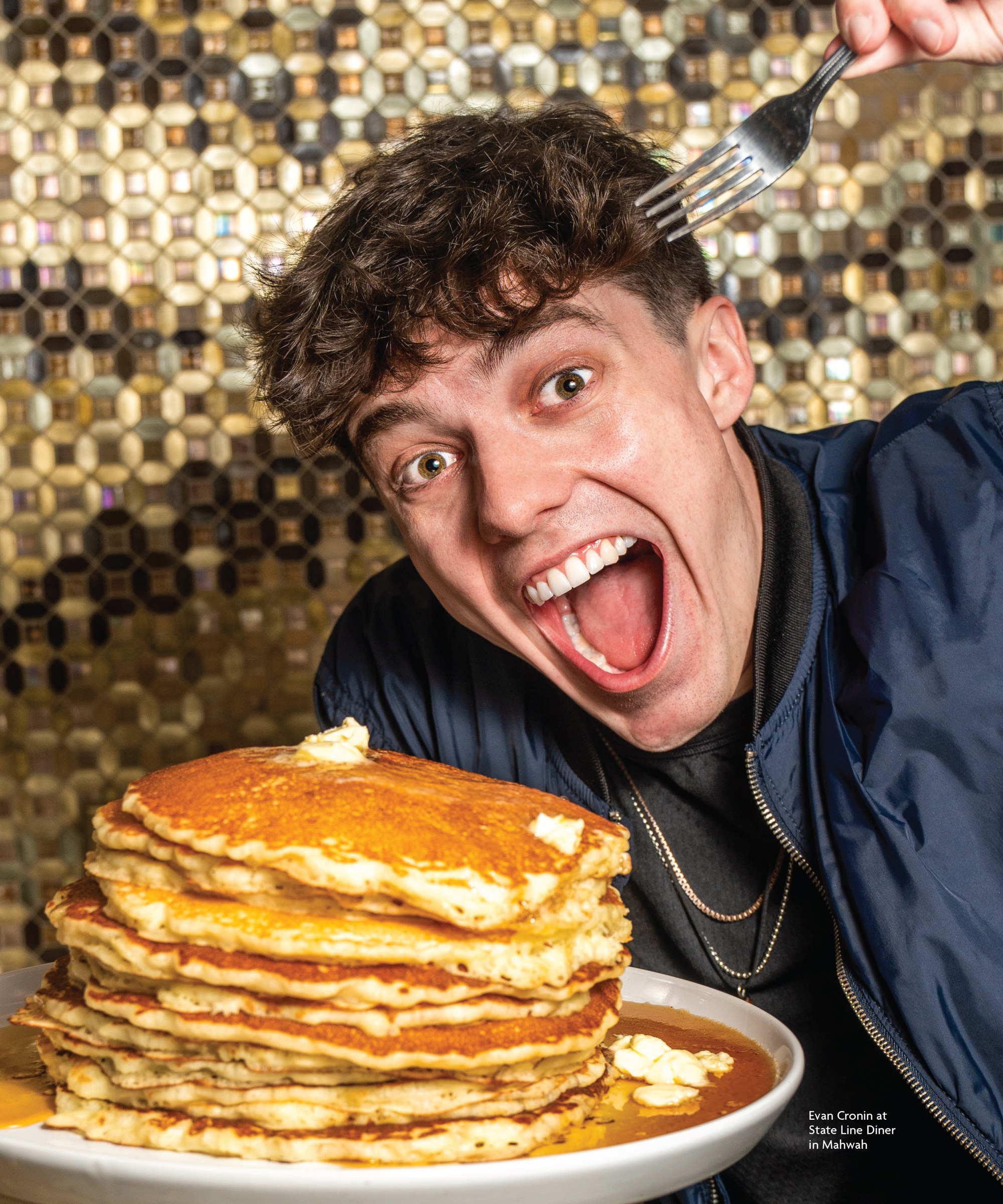 Alternate cover portrait of Evan Cronin with a stack of pancakes