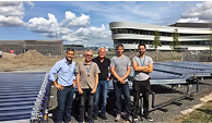 Naked Energy team and external clients in front of Virtu solar thermal array.