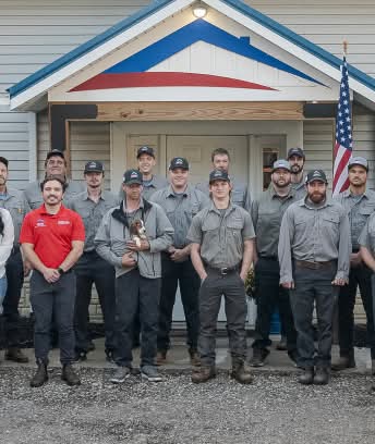 Professional headshot of smiling man in suit, NPCA Cards background