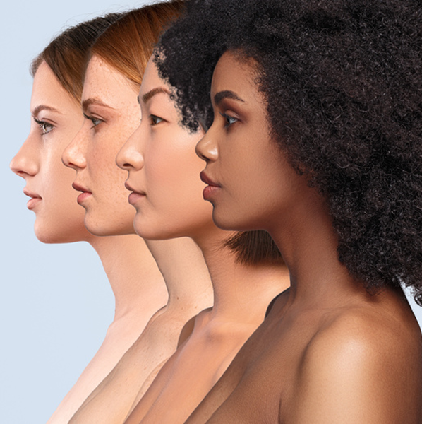 Profile views of four women of diverse ethnicities with different skin tones and hair types aligned side by side.