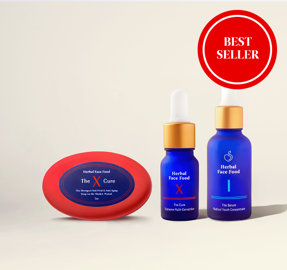 Four blue dropper bottles numbered I to IV surrounded by assorted green and colorful flowers and foliage.