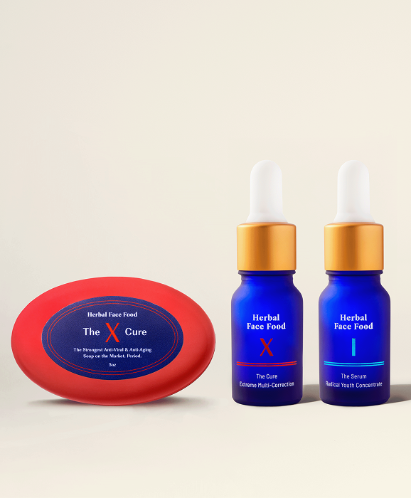 Two blue dropper bottles with gold caps and a red oval container, all labeled 'Herbal Face Food' and 'The X Care,' on a light background.