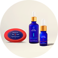 Three skincare products including a blue dropper bottle, a smaller blue bottle, and a red soap bar on a beige surface.