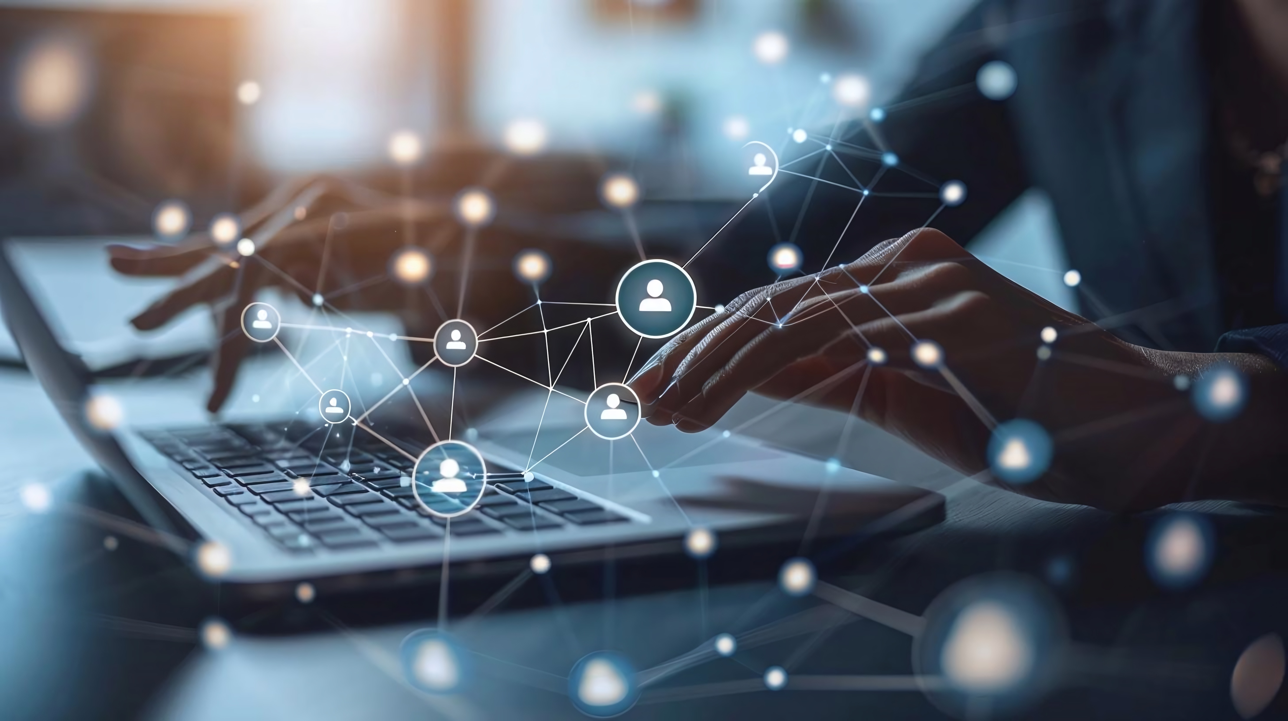 Hands typing on a laptop keyboard with a digital network overlay connecting user icons.