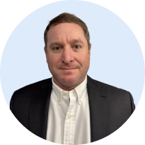 Portrait of Taylor wearing a blazer and buttoned dress shirt